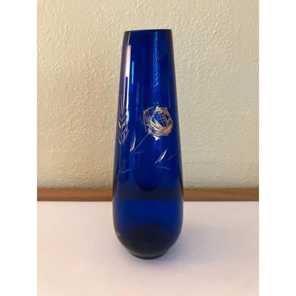 blue glass vase with etched rose